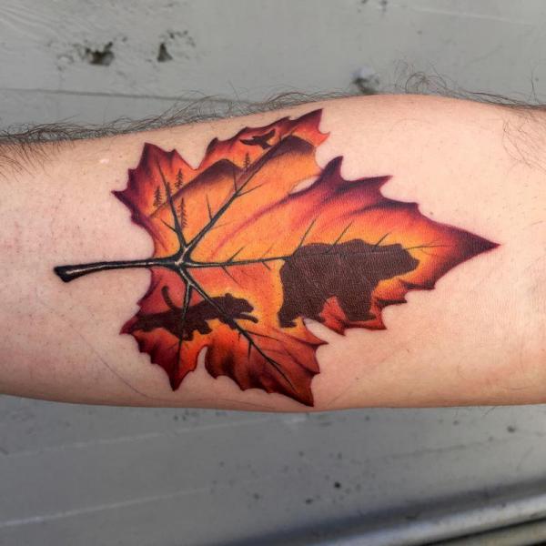 leopard and bear silhouette on a maple leaf.JPG