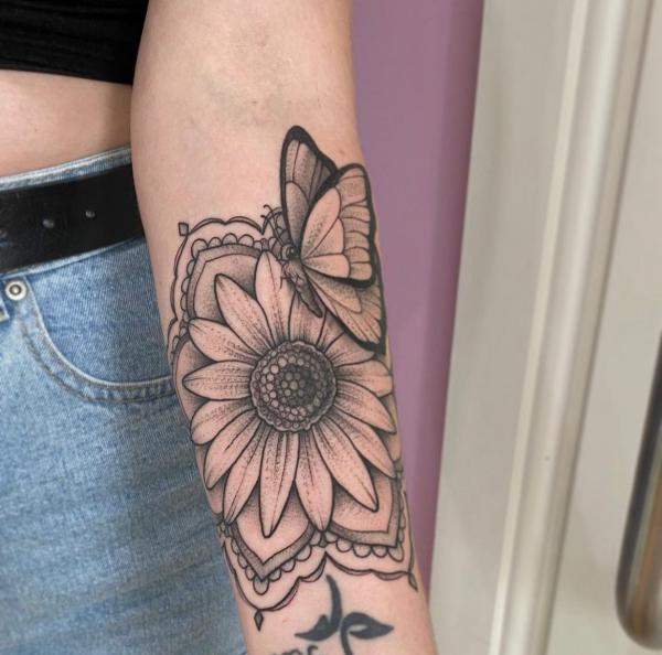 sunflower and butterfly inner forearm tattoo