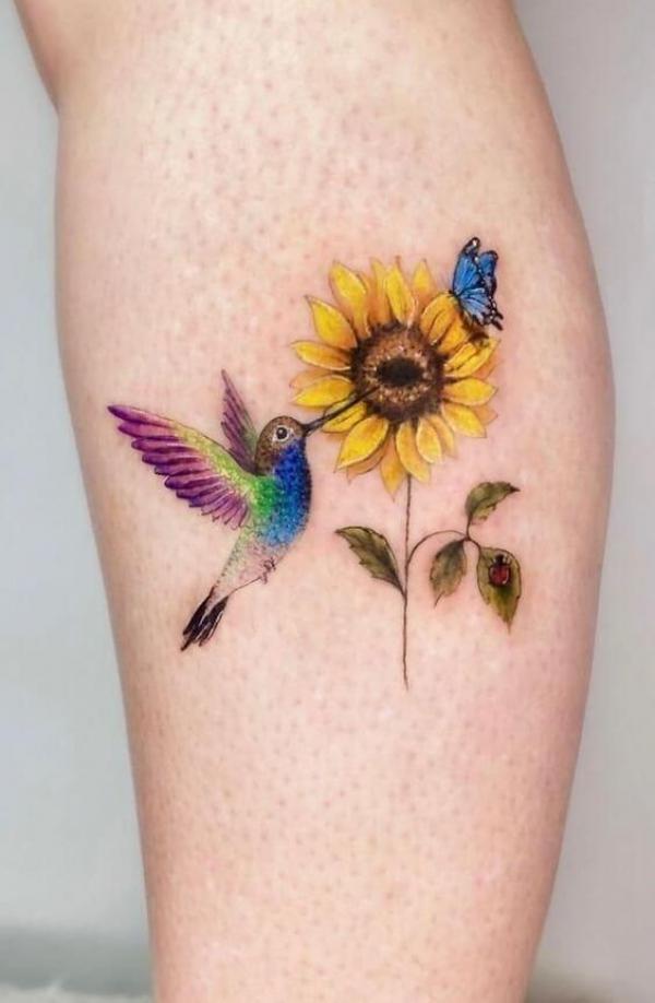 sunflower and butterfly with hummingbird tattoo