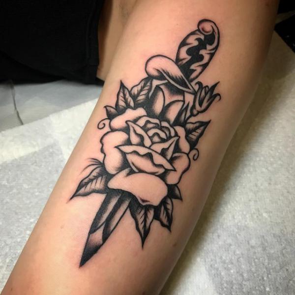 traditional dagger and rose tattoo black and white