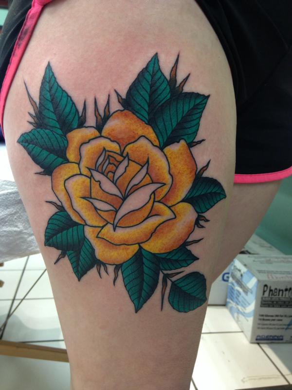 traditional yellow rose thigh tattoo