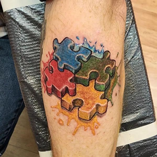 3D four puzzle with watercolor splash tattoo