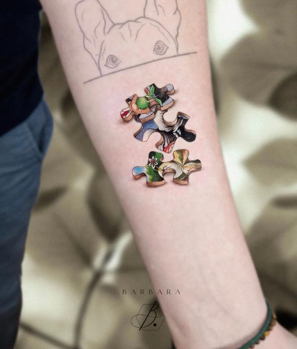 3D puzzle tattoo on forearm
