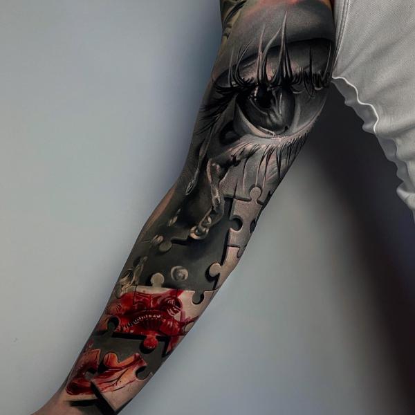 3D puzzle with eye tattoo sleeve