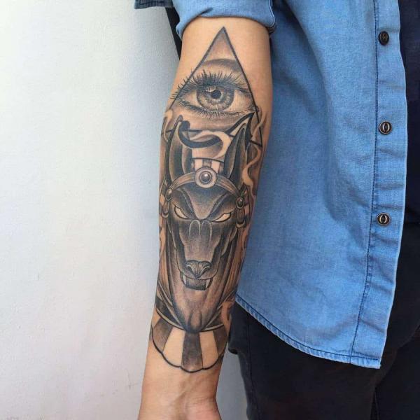 All seeing eye and anubis forearm tattoo