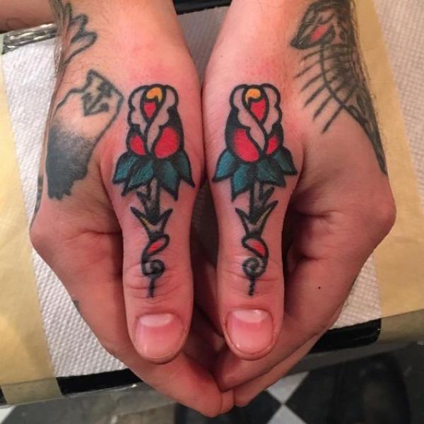 American traditional rose tattoo on both thumbs for couples