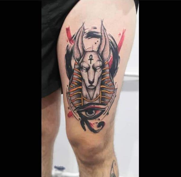 Anubis and Eye of Horus thigh tattoo