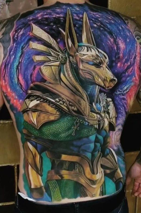 Anubis and galaxy tattoo on back