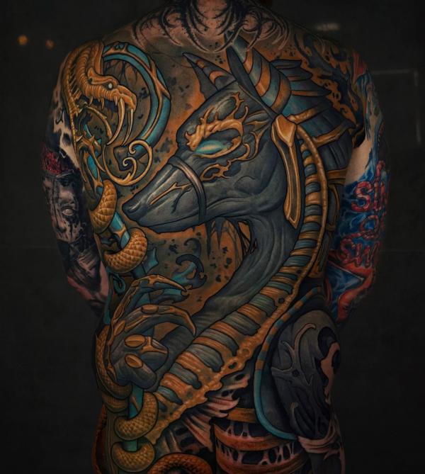 Anubis and snake back tattoo