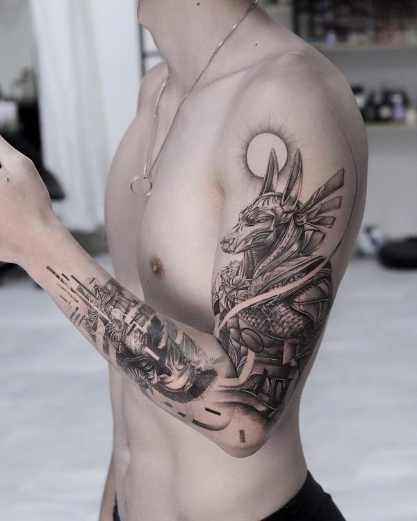 Anubis and sun tattoo