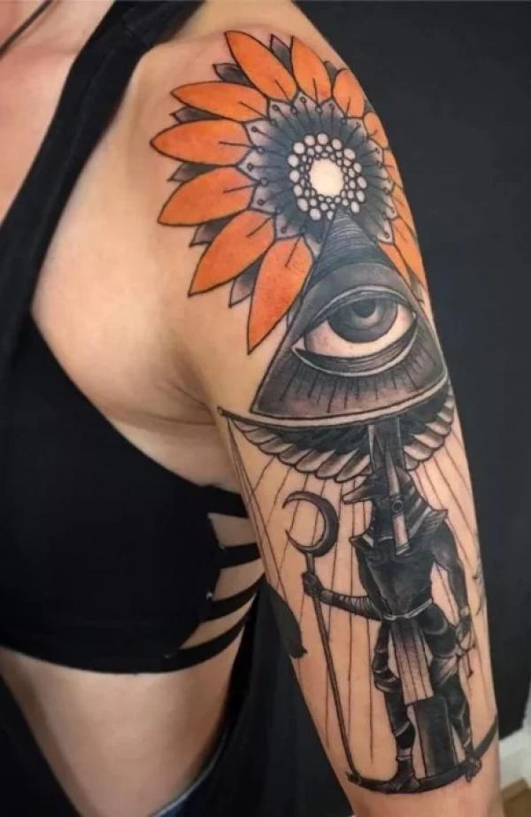 Anubis eye and sunflower tattoo