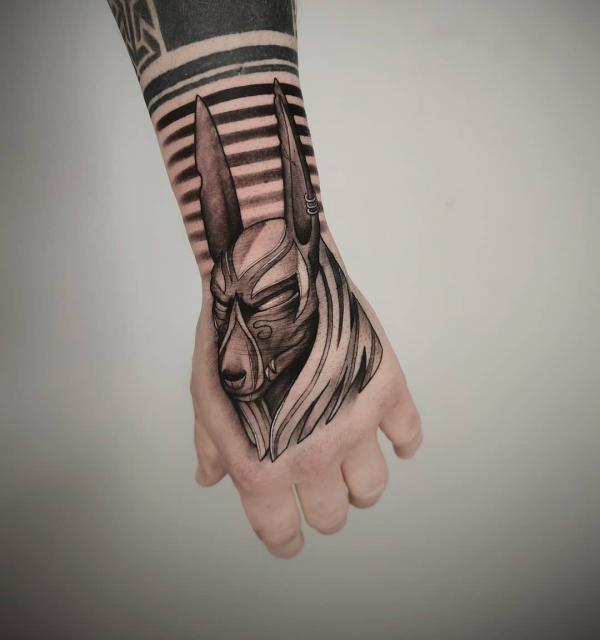 Anubis head hand tattoo