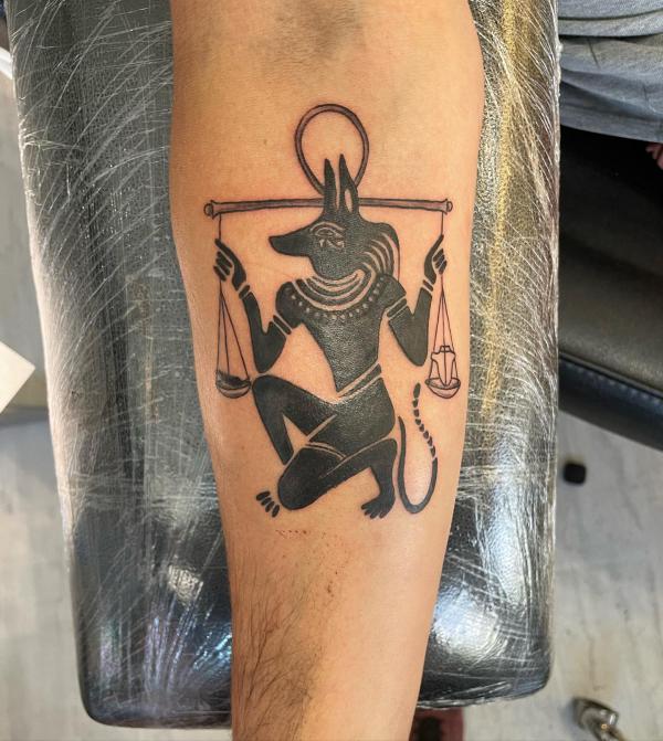 Anubis heart and feather scale tattoo
