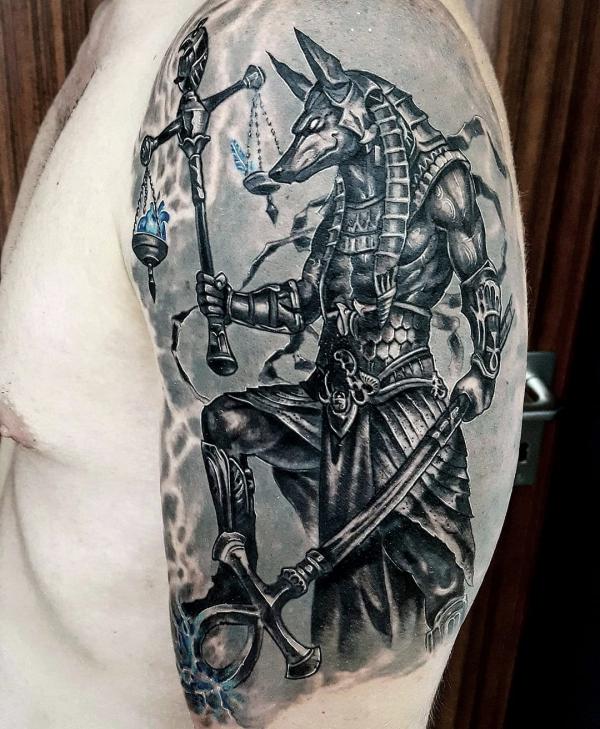 Anubis holding a pair of scales and Ankh tattoo
