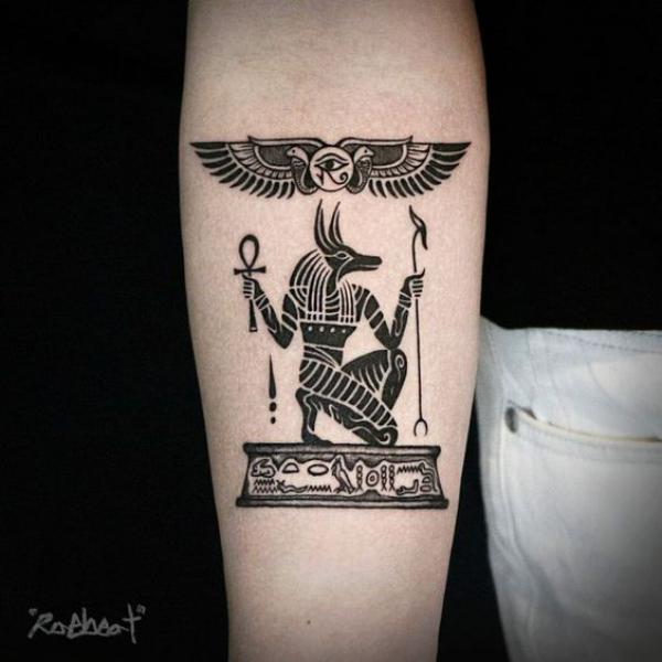 Anubis holding scepter and Ankh with sun disk tattoo