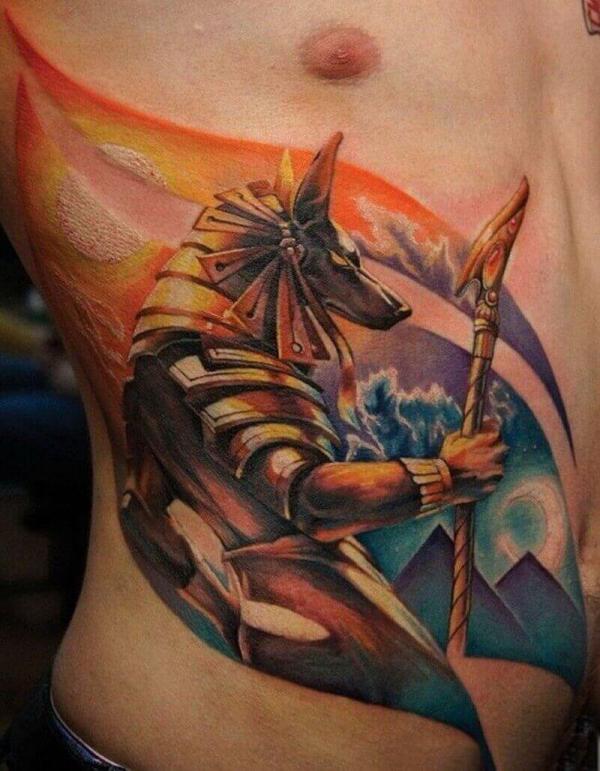 Anubis holding was scepter rib cage tattoo