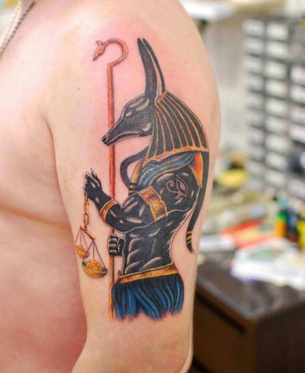 Anubis holding was scepter weighing life and death