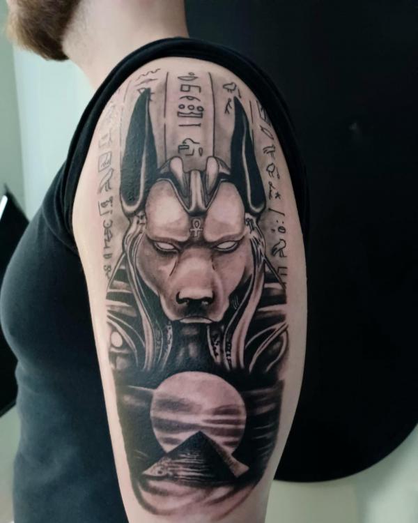 Anubis with Hieroglyphics moon half sleeve tattoo