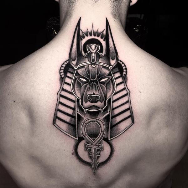 Anubis with nemes headdress and Ankh dotwork back tattoo