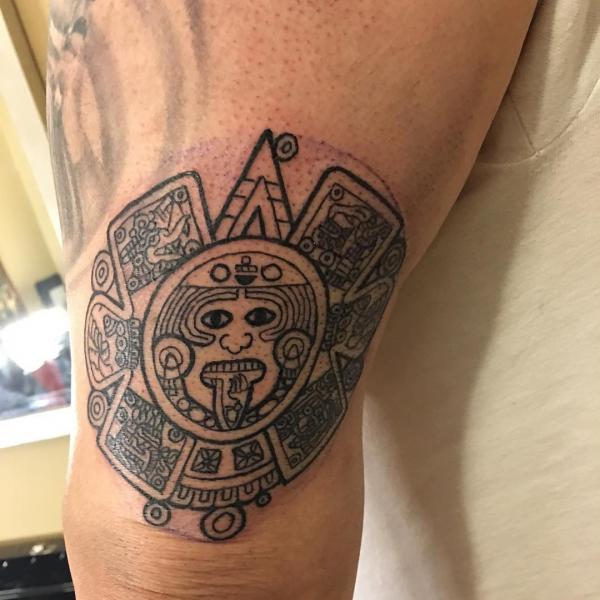 Aztec calendar tattoo on knee