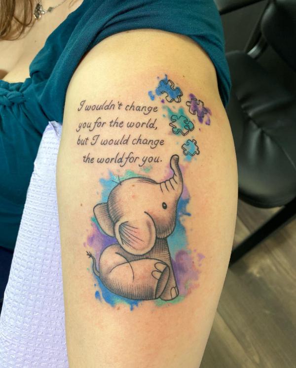 Baby elephant and puzzles tattoo with words I wouldn't change you for the world but I would change the world for you