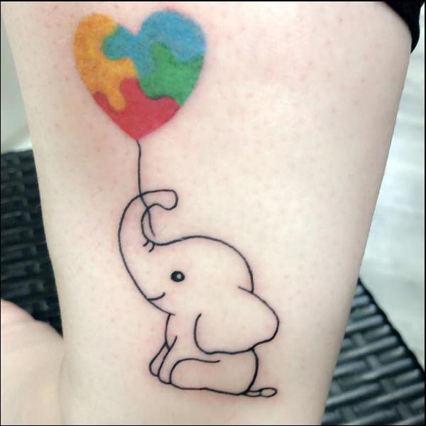 Baby elephant outline with puzzle heart balloon tattoo