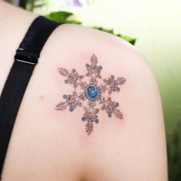 Baroque snowflake shoulder tattoo