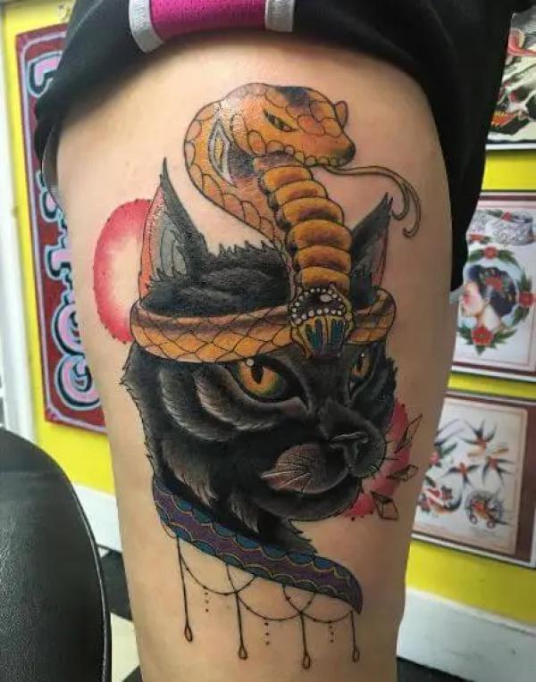 Baste and snake tattoo