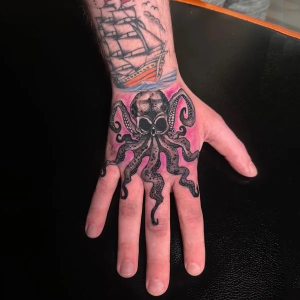 Black Kraken Hand tattoo with traditional ship