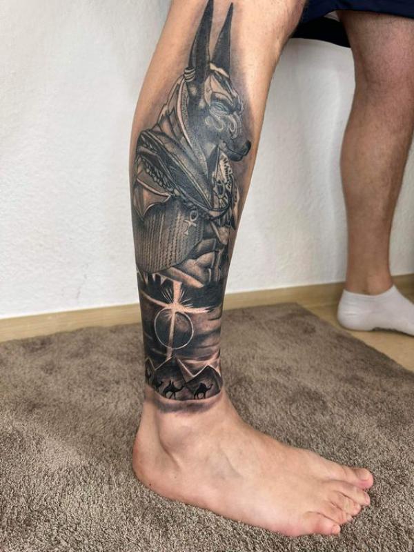 Black and grey Anubis and Pyramids tattoo