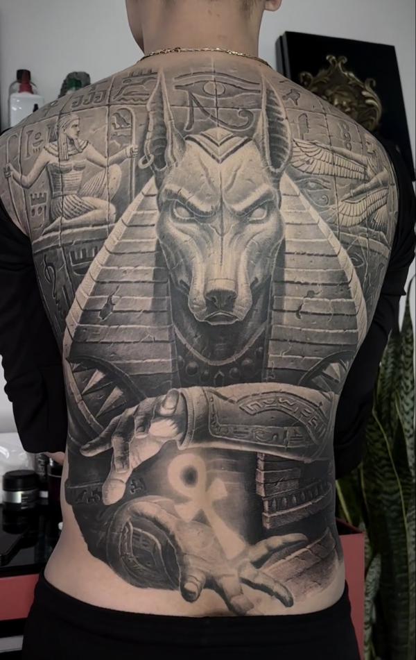 Black and grey Anubis mural full back tattoo