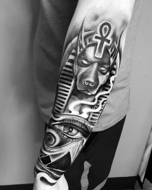 Black and grey Anubis with Ankh Pyramids and Eye of Ra tattoo