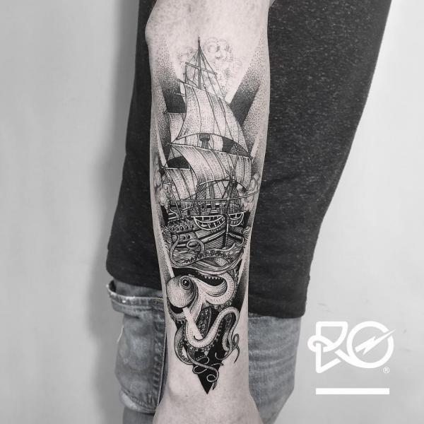 Black and grey Kraken and boat tattoo