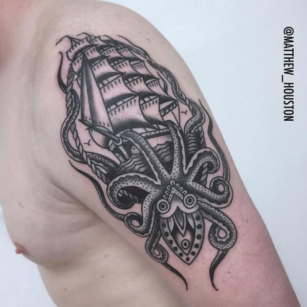 Black and grey Kraken and ship quarter sleeve tattoo