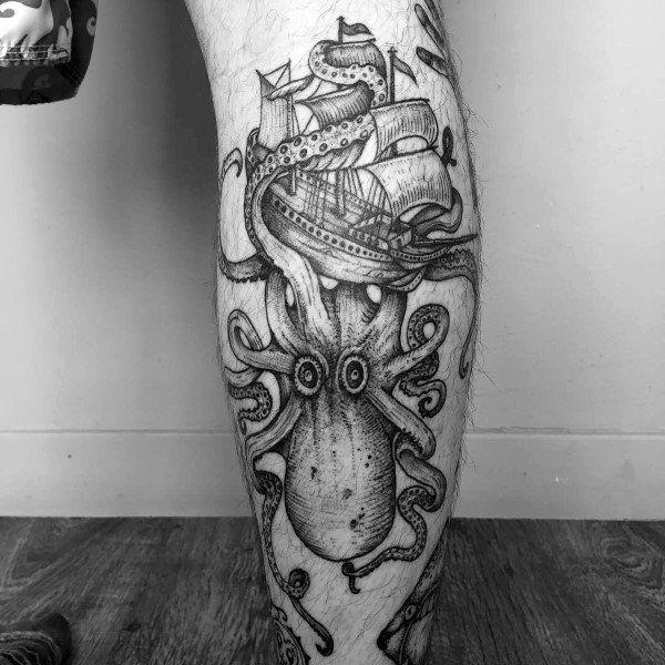 Black and grey Kraken and ship tattoo