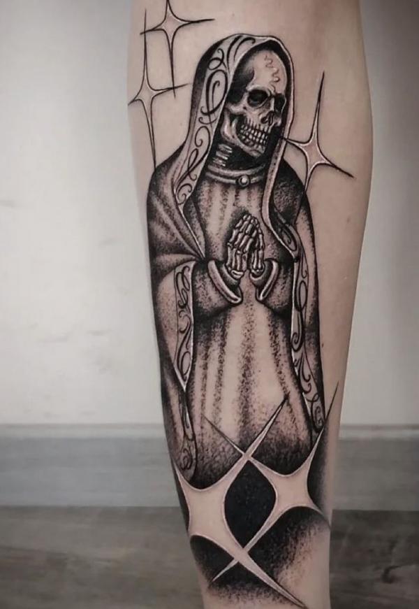 Black and grey Santa Muerte with stars tattoo