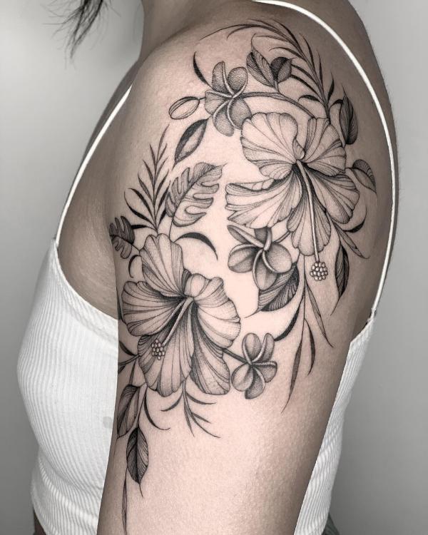 Black and grey hibiscus and plumeria tattoo