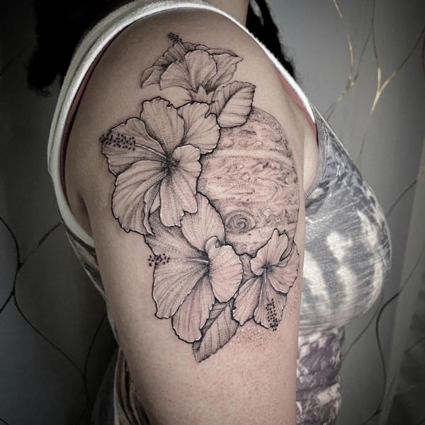 Black and grey hibiscus shoulder tattoo