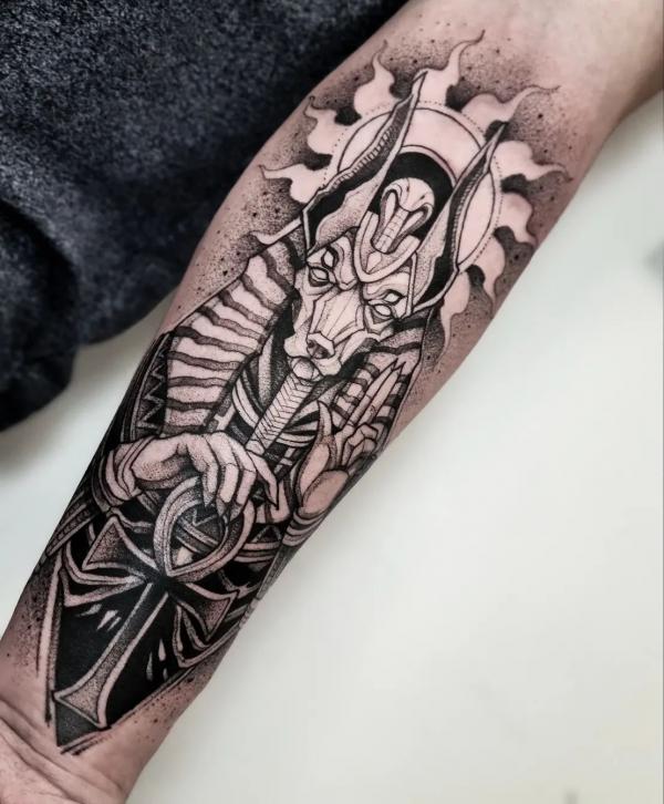 Black and white Anubis Ankh and sun tattoo