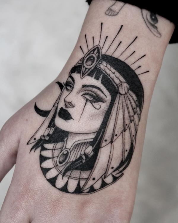 Black and white Cleopatra hand tattoo