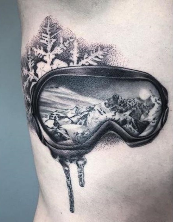 Black and white mountains in sunglass with snowflake tattoo