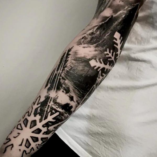 Black and white snowflake tattoo sleeve