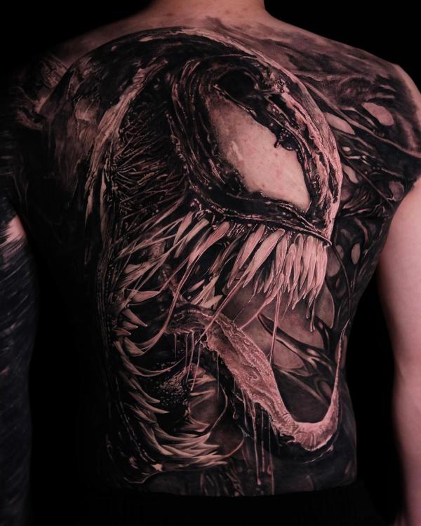 Black and white venom face full back tattoo