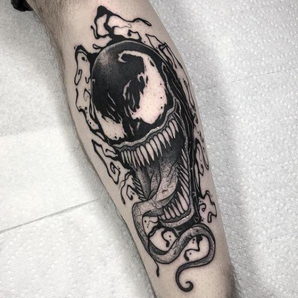 Black and white venom tattoo