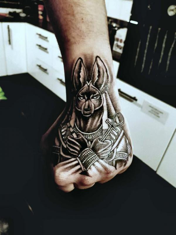 Blackwork Anubis with ANkh hand tattoo