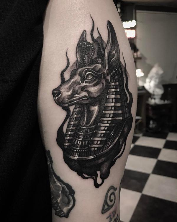 Blackwork Anubis with cobra tattoo