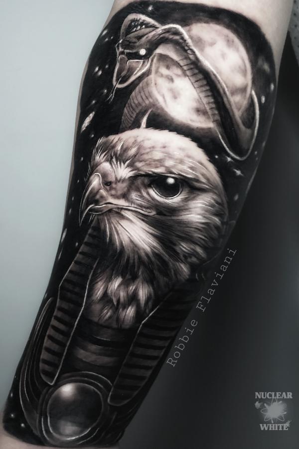 Blackwork Horus and cobra tattoo