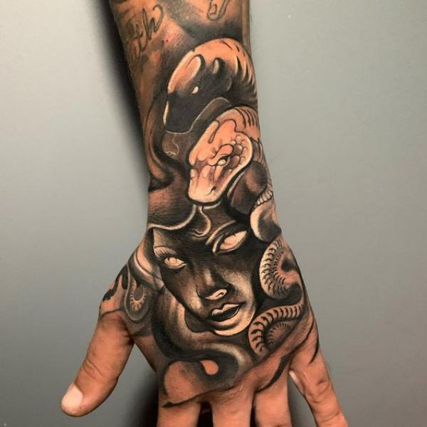 Blackwork Medusa and snakes hand tattoo