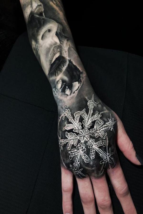 Blackwork Snowflake hand tattoo