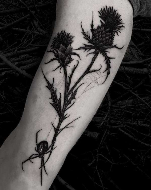 Blackwork thistle tattoo